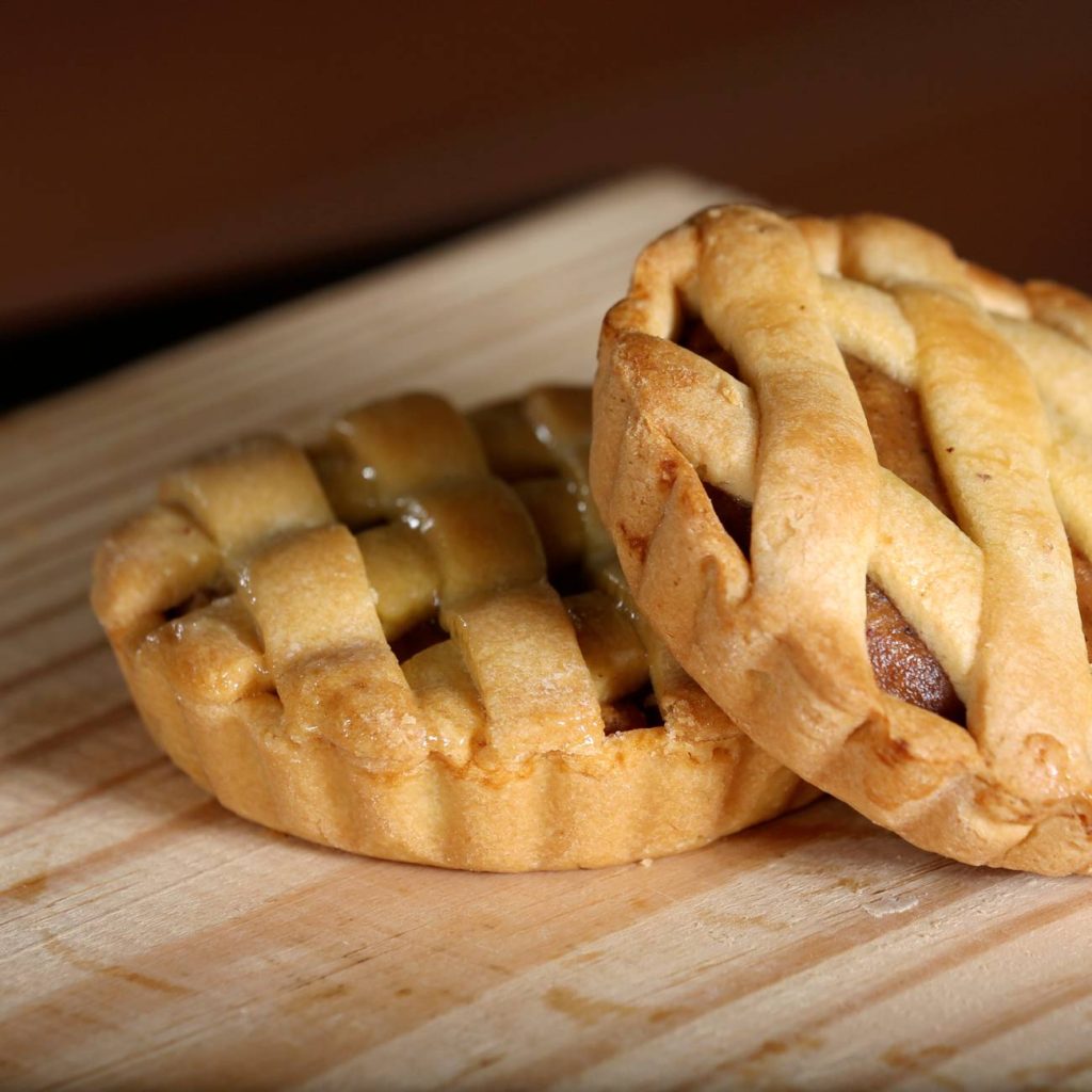 2 lattice style pies layered one on top of the other